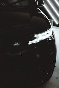 A close up of a car parked in a garage