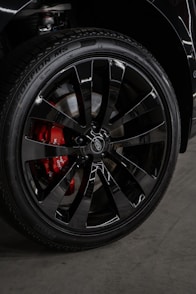 A close up of a black truck tire