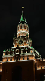 A very tall building with a clock on it's side