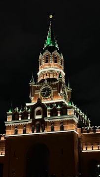 A very tall building with a clock on it's side