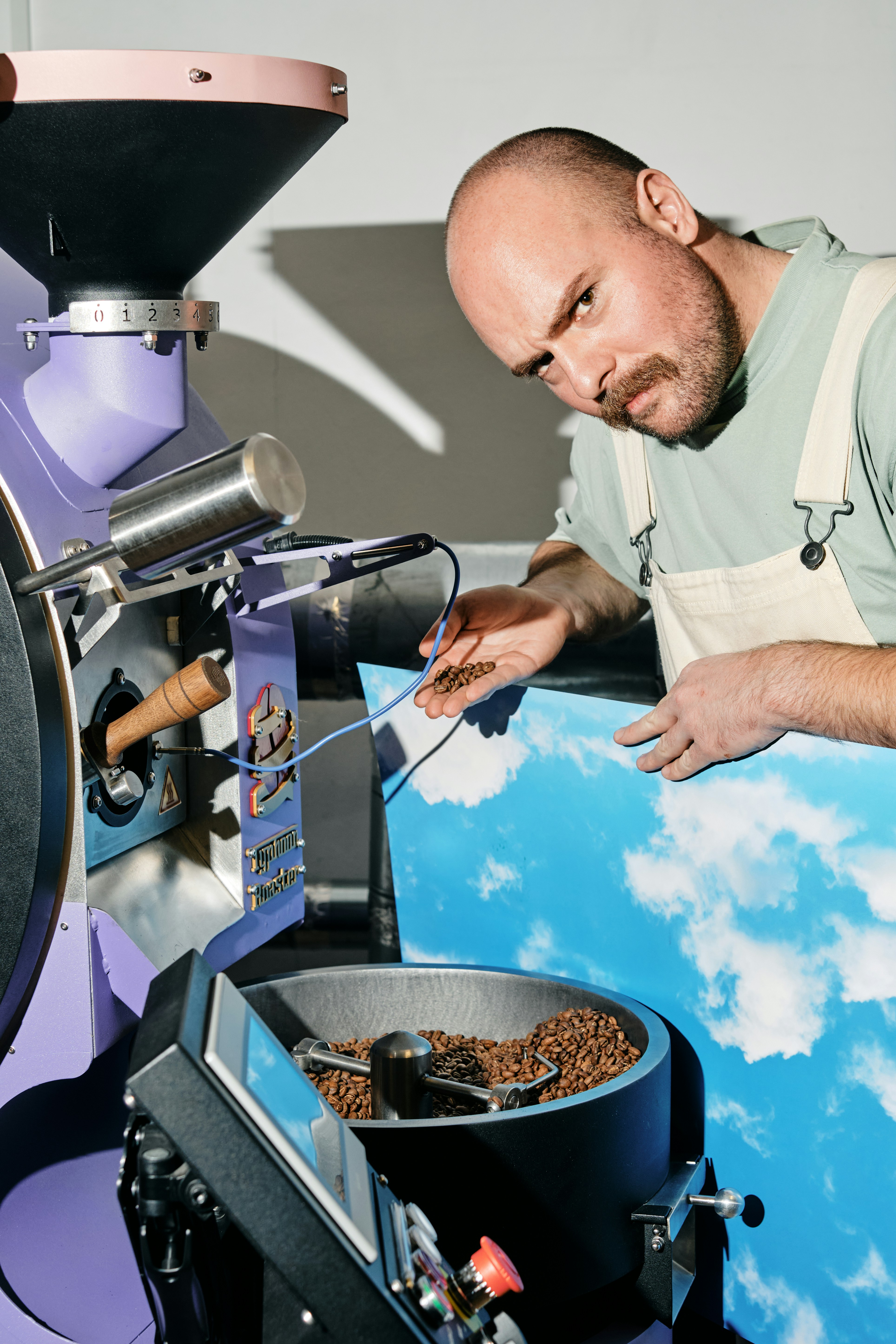 A man is making something out of a machine