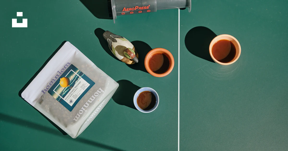 A table topped with two cups of coffee photo – Free Coffee roastery ...