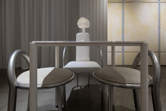 A room with a table and two chairs