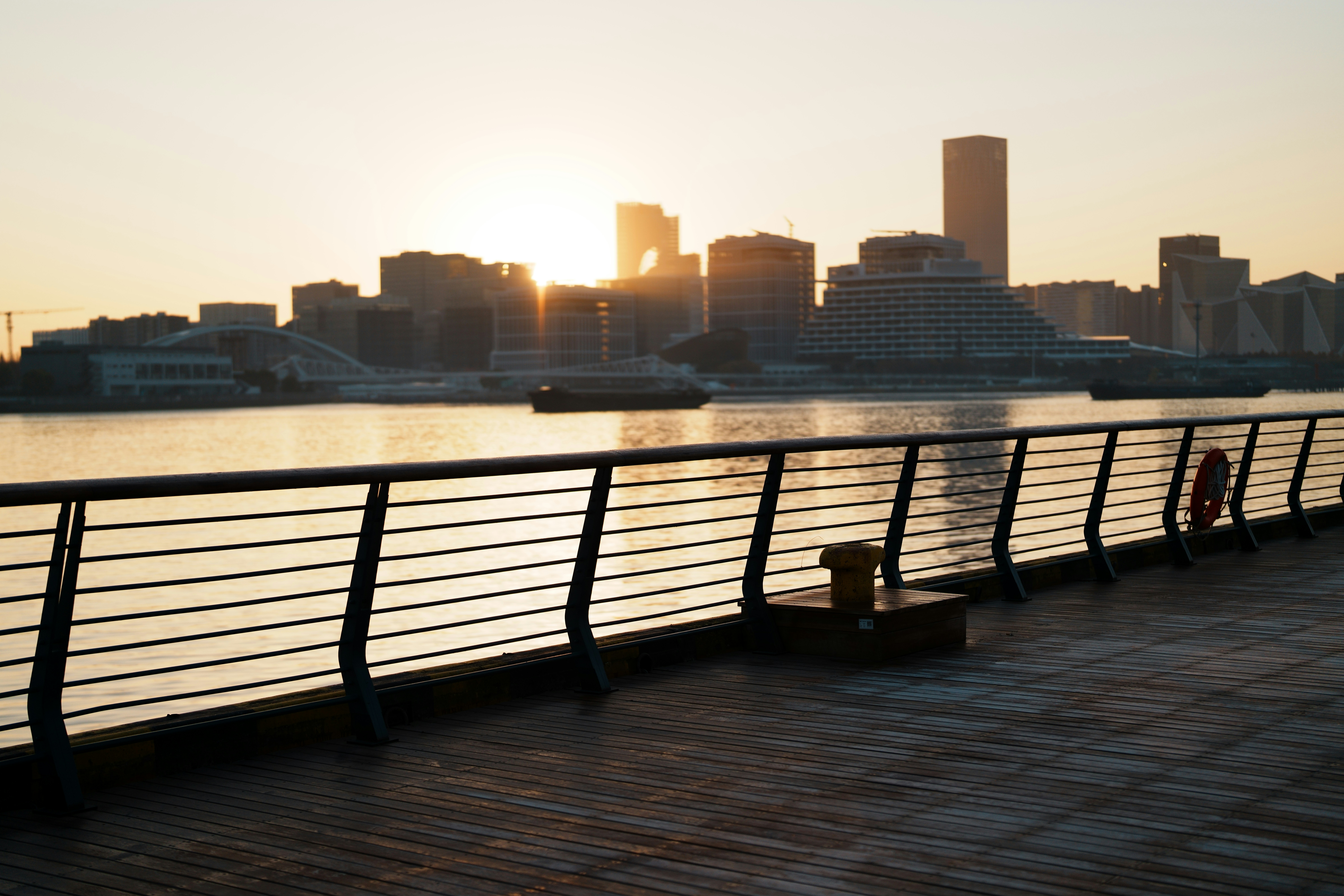 The sun is setting over the city skyline