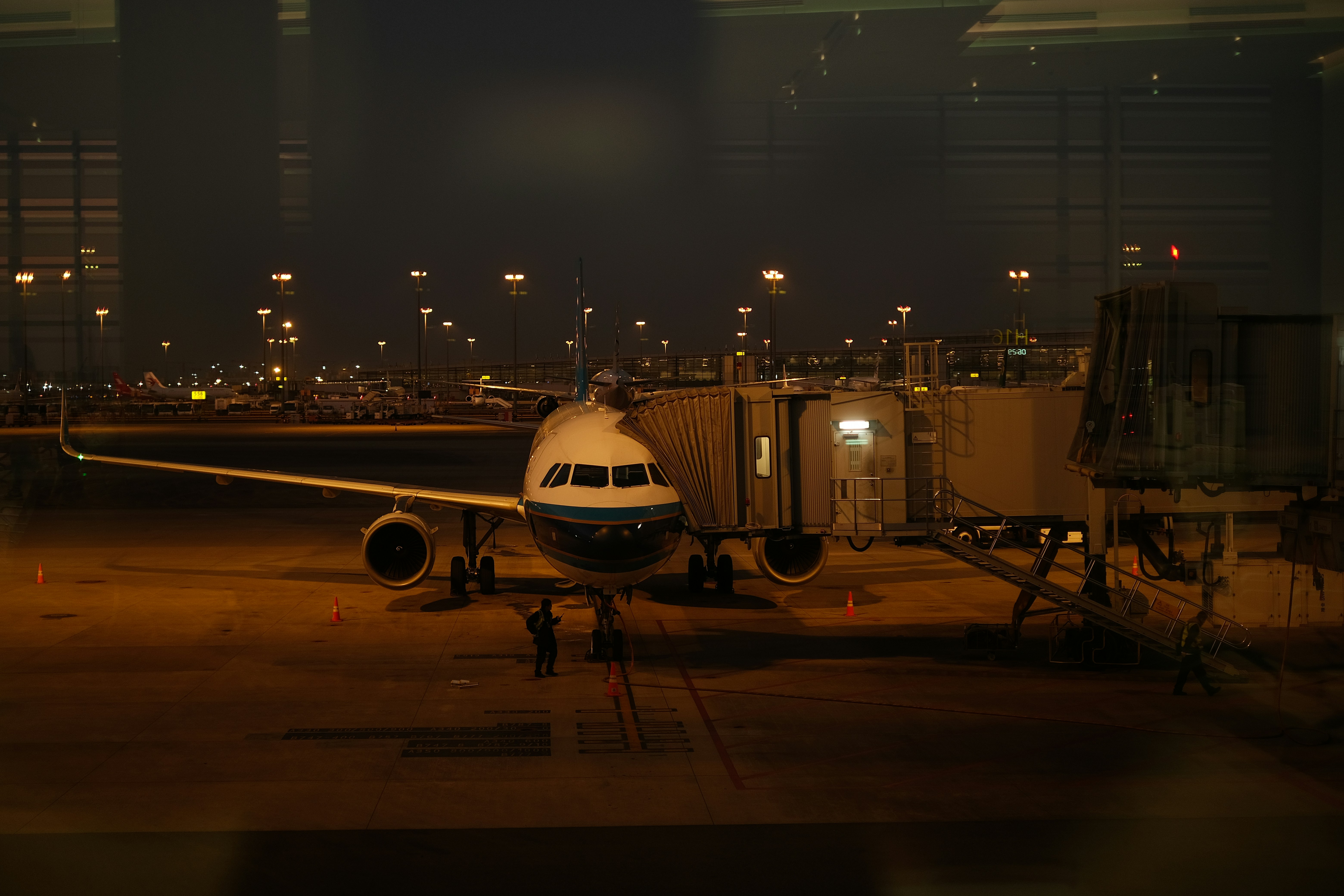 A large jetliner sitting on top of an airport tarmac, 