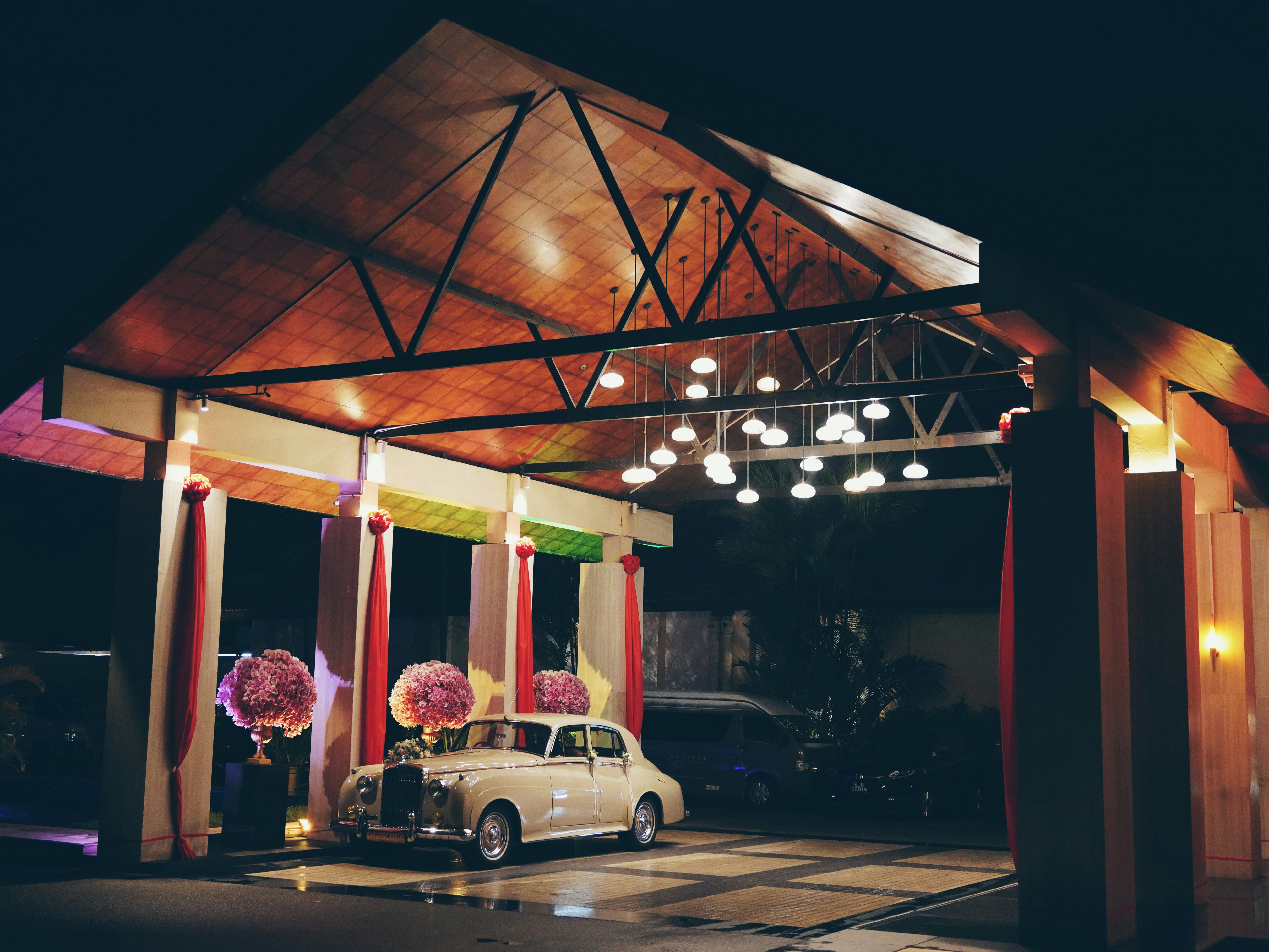 Conference style seating facing a presentation screen in a modern room