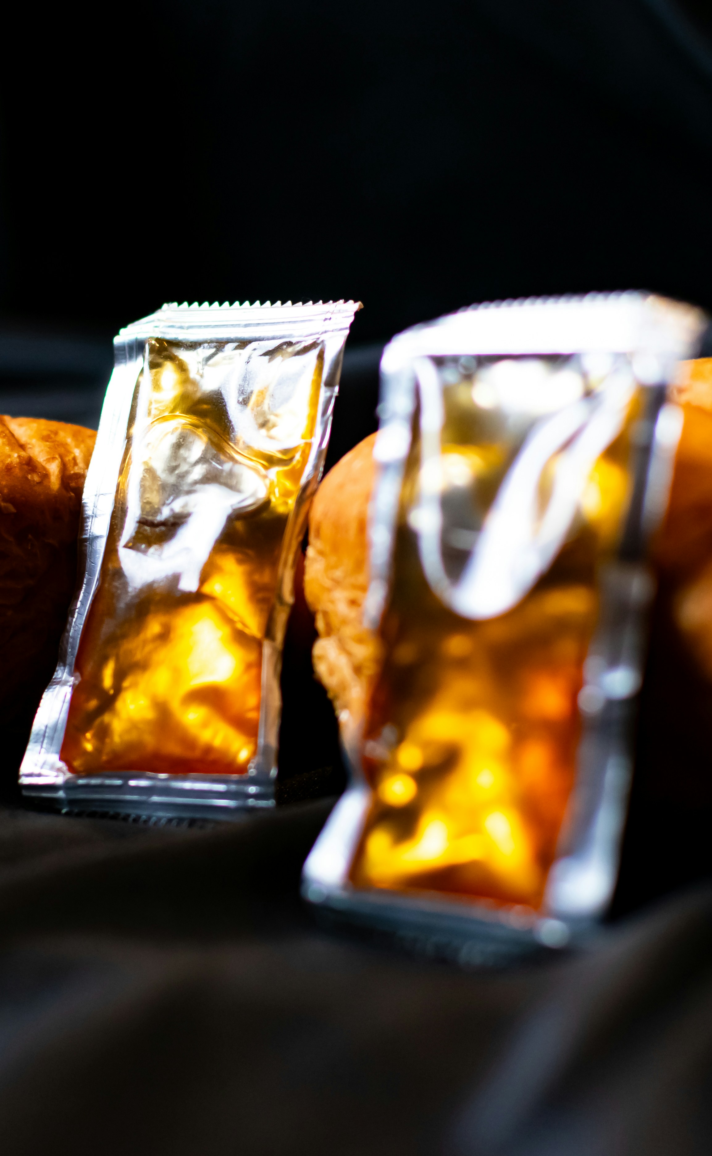Three bags of food sitting on top of a table