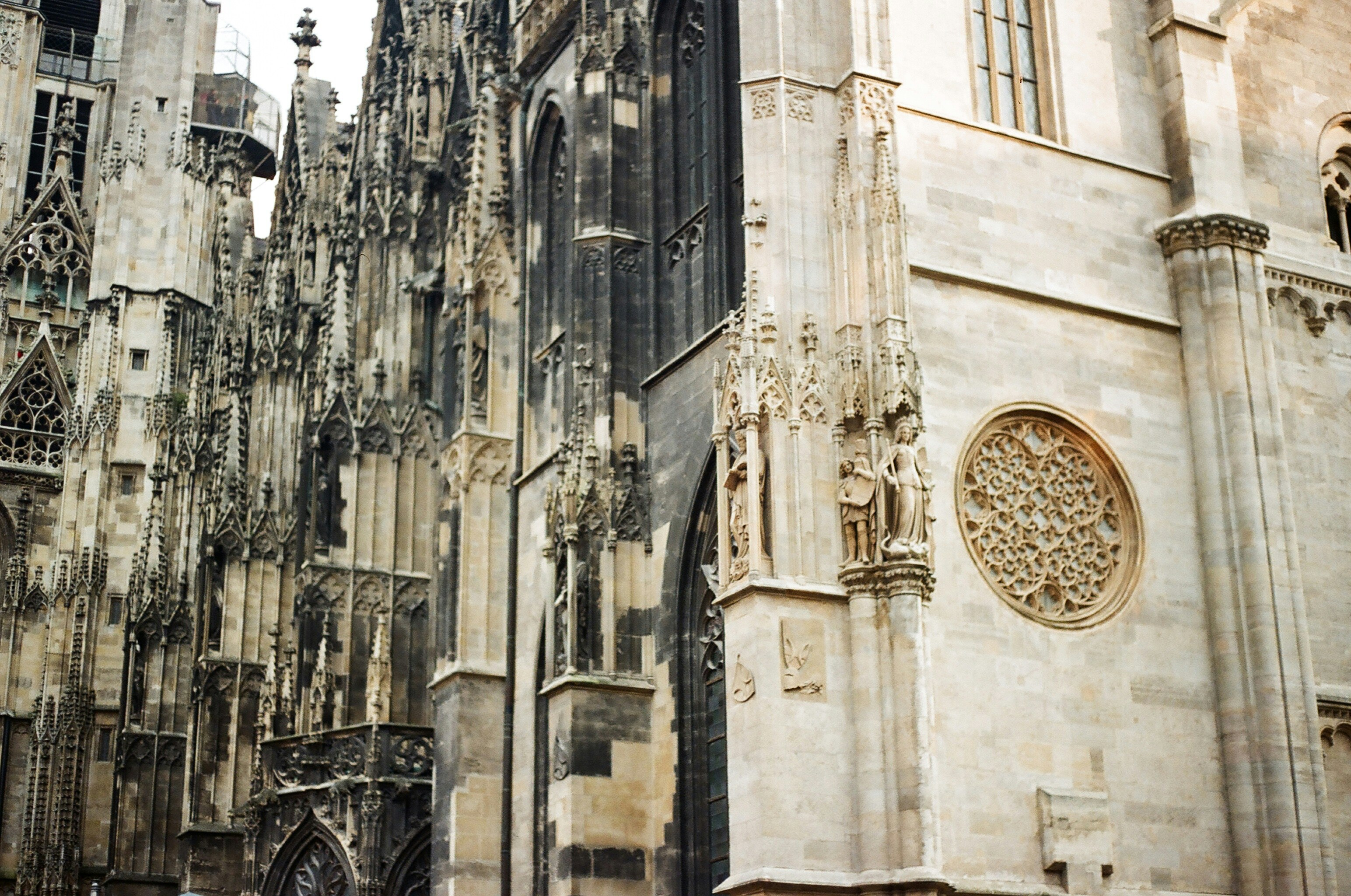 A large cathedral with a clock on the side of it