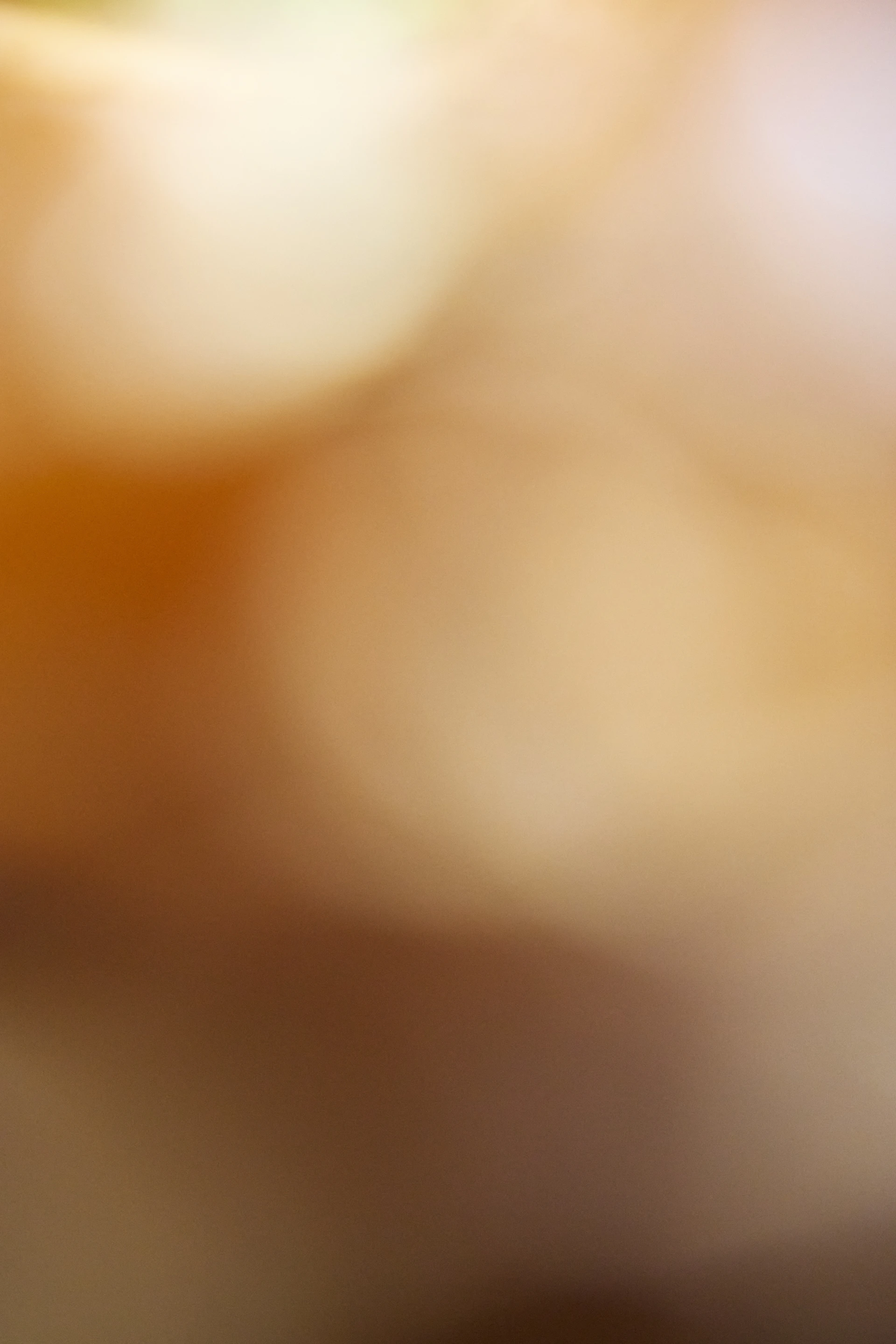 A blurry image of an apple with a bite taken out of it