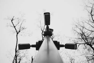 A black and white photo of a street light