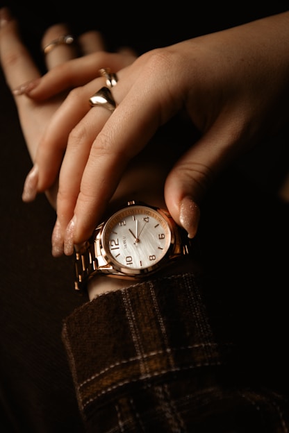 A woman's hand with a watch on her wrist