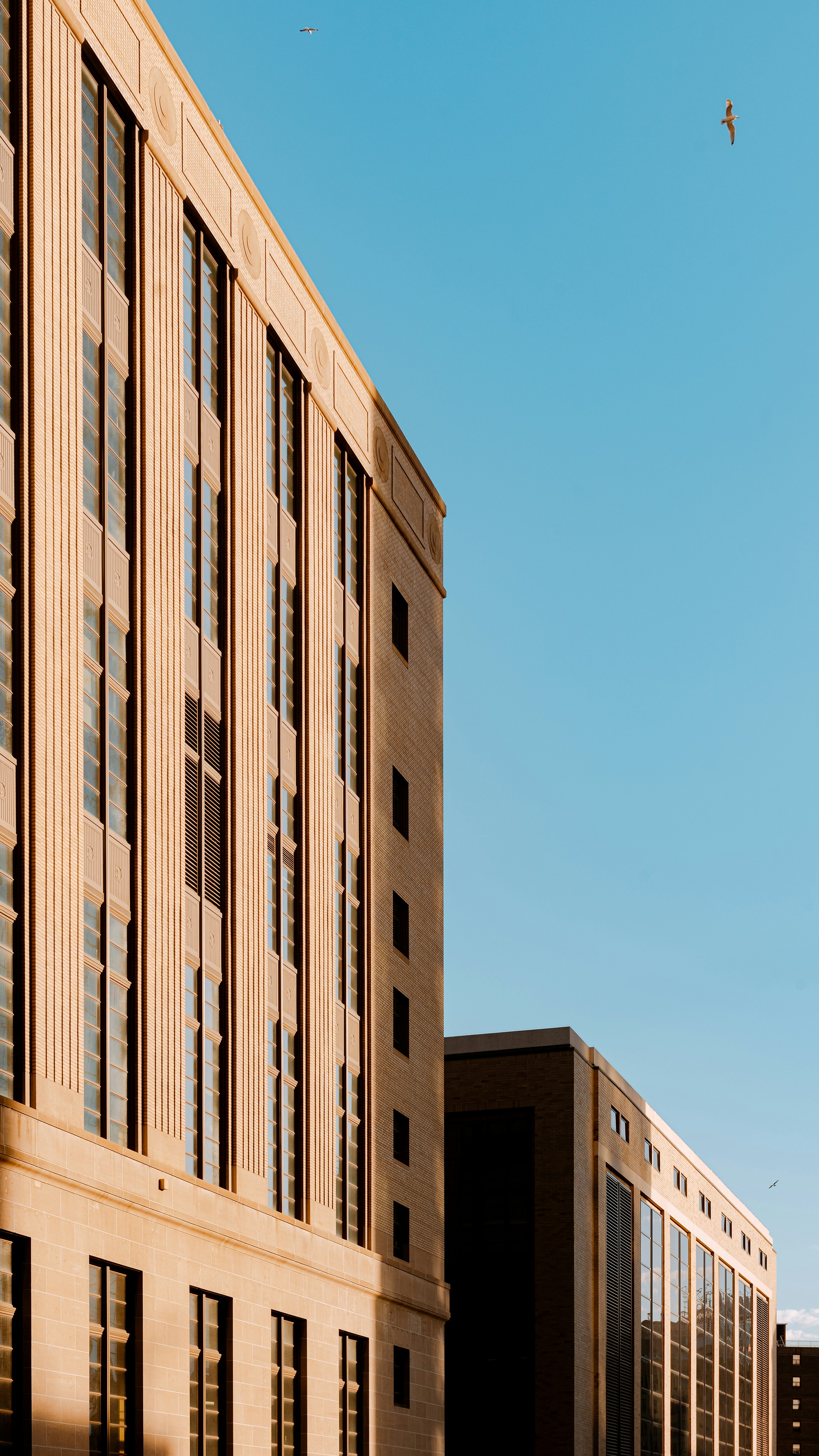 A tall building sitting next to a parking lot