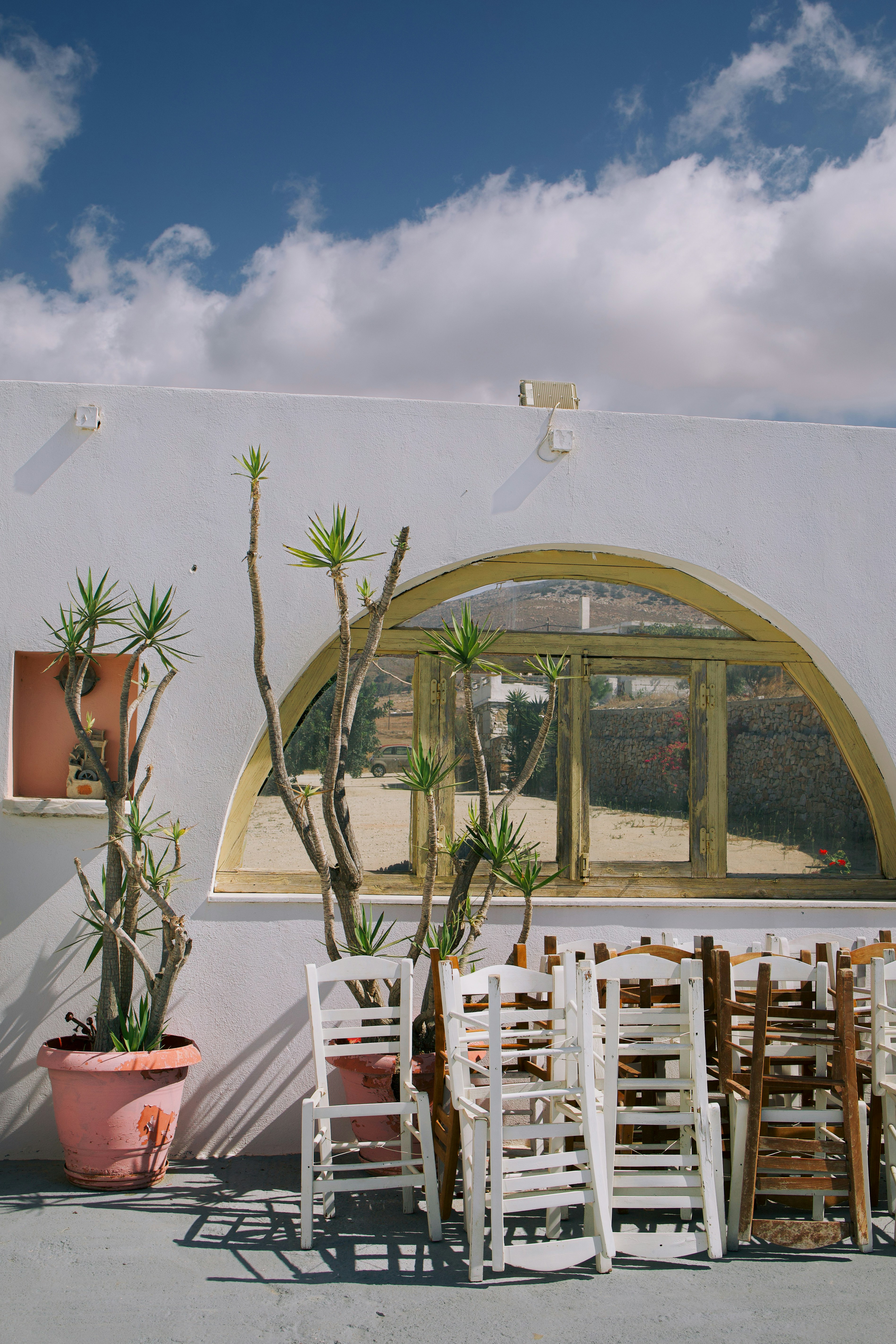 A group of chairs sitting outside of a building