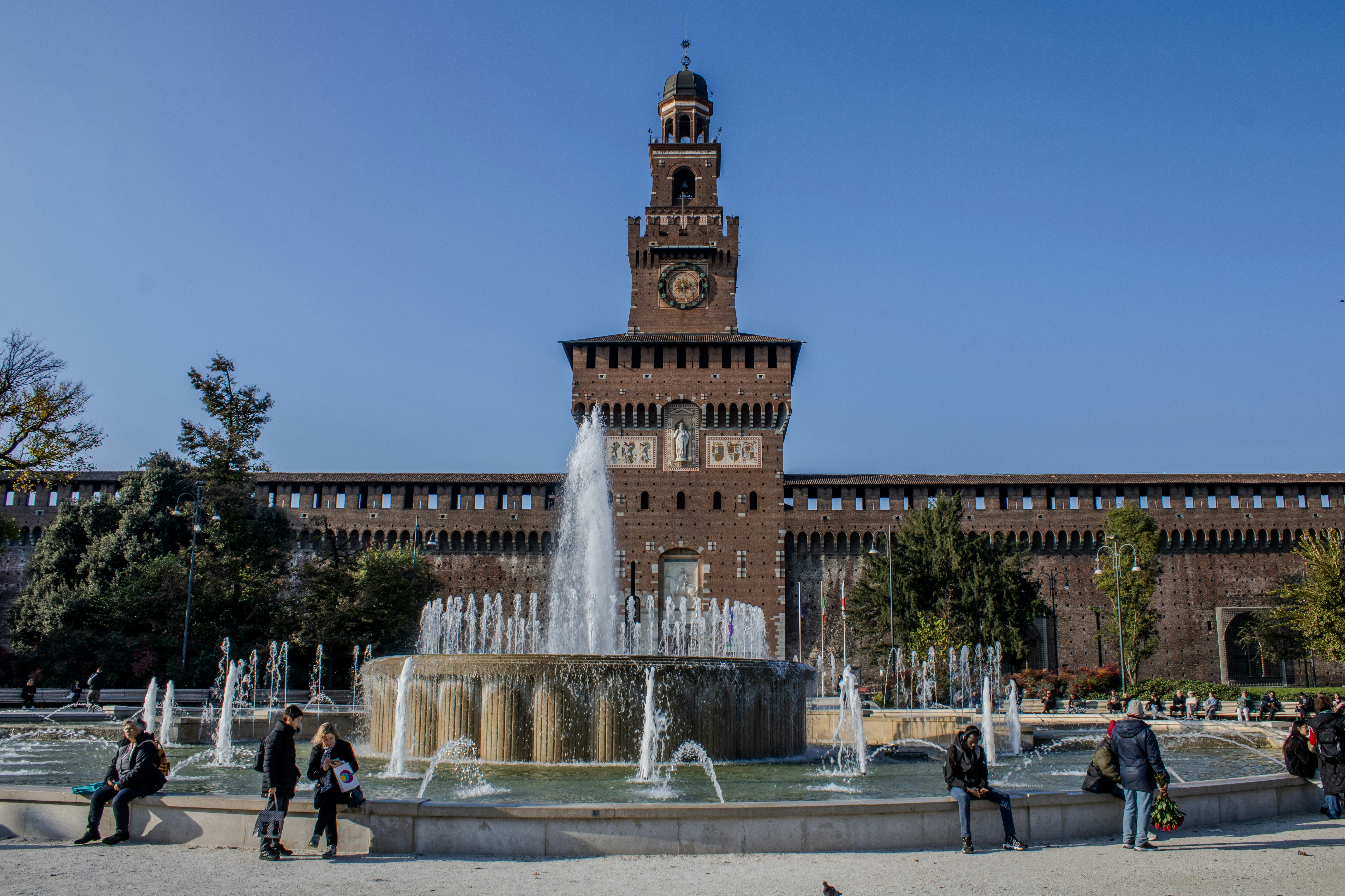 A large building with a fountain in front of it