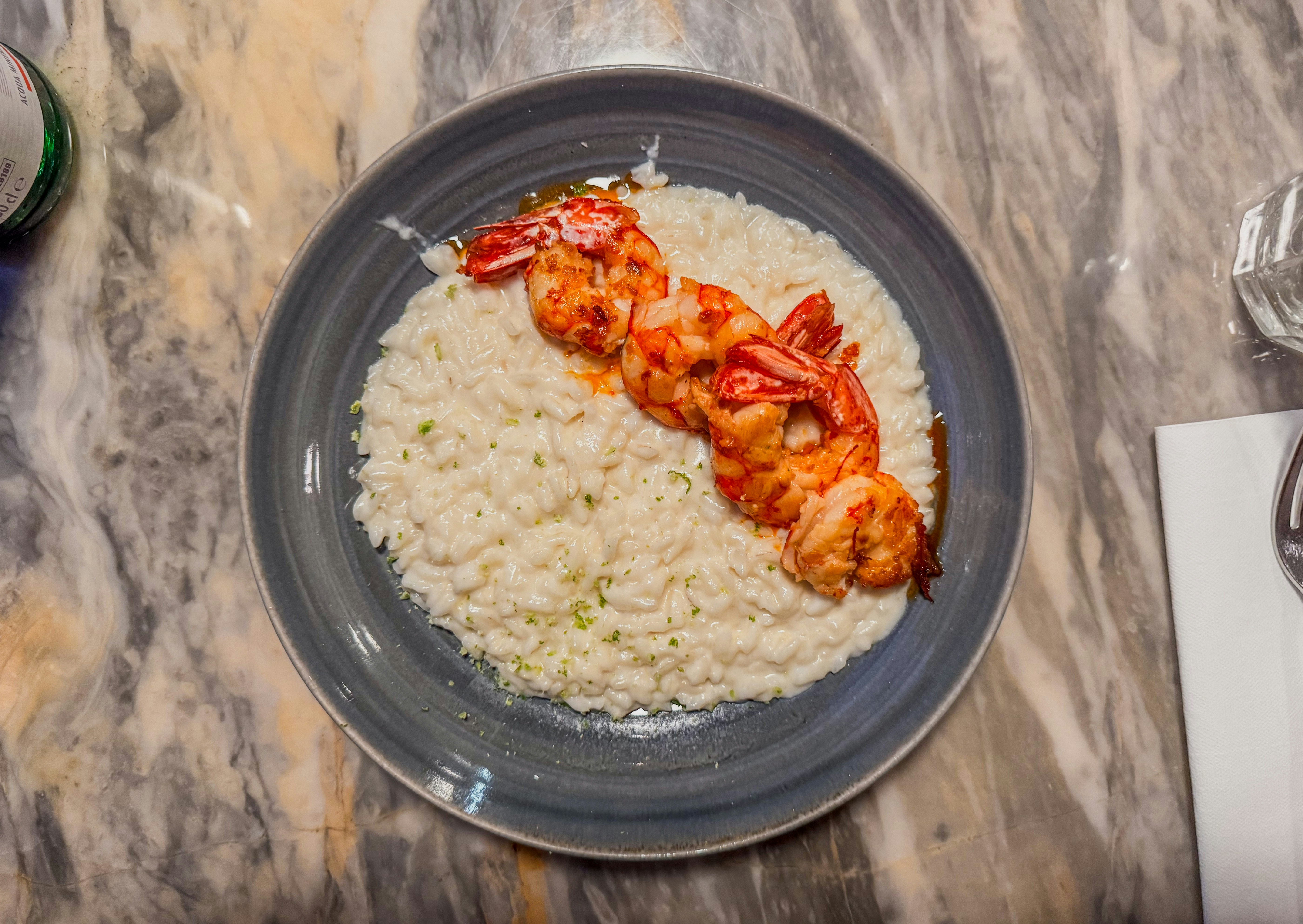 A plate of shrimp and rice on a table