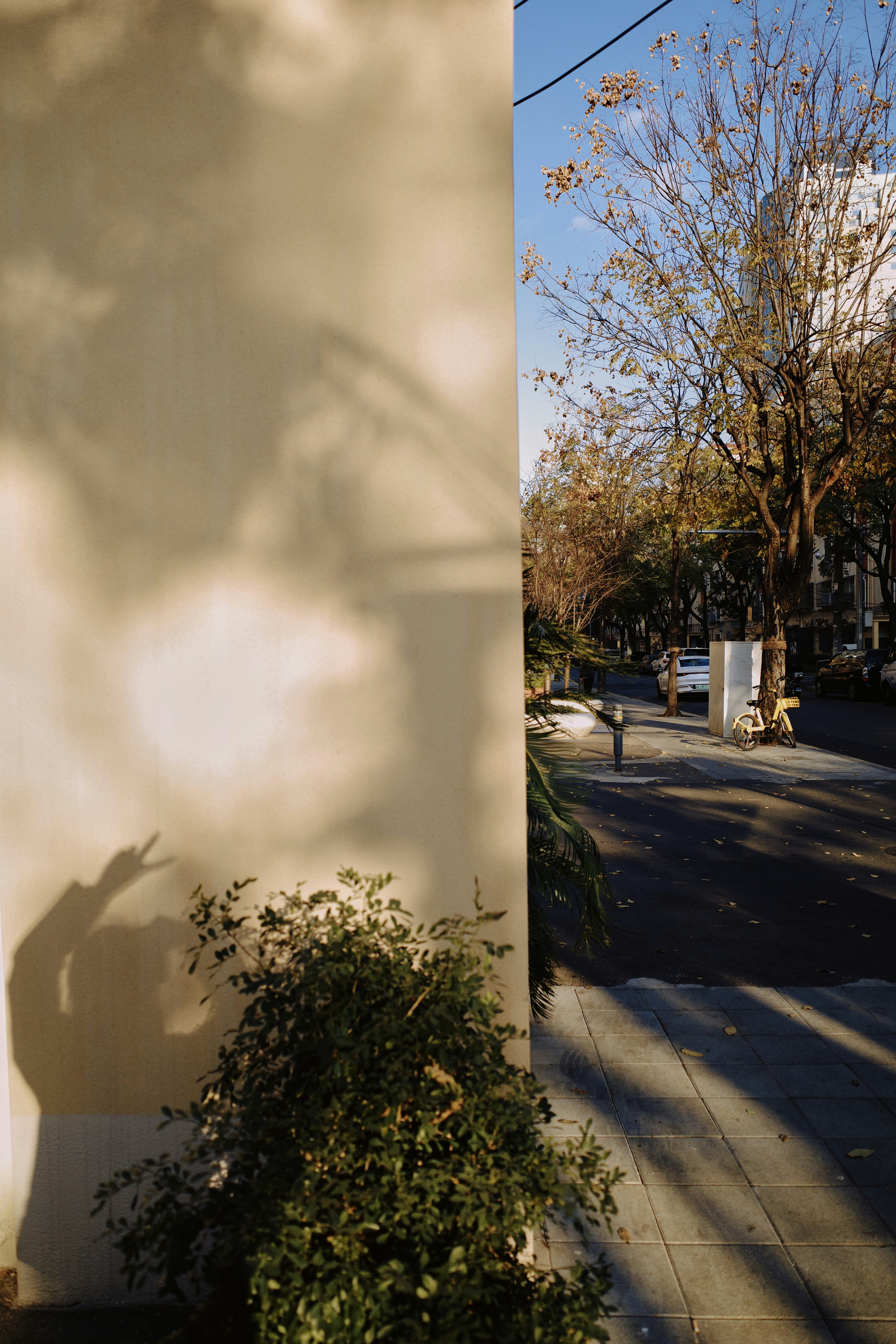 A white building with a clock on the side of it