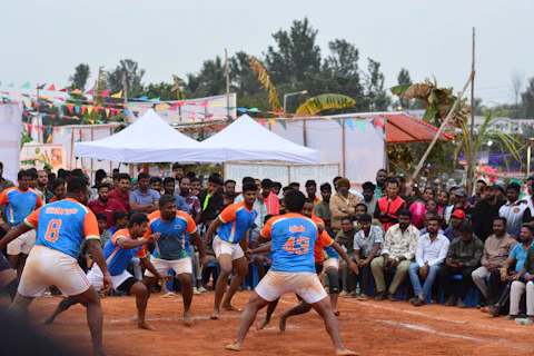 A group of men playing a game of frisbee
