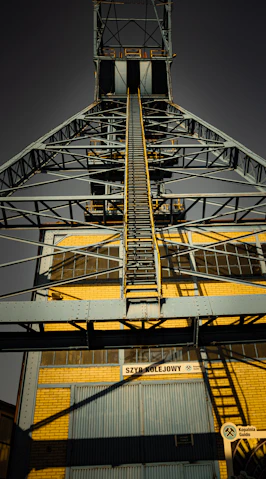 A tall metal structure with a sky background