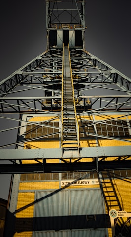 A tall metal structure with a sky background