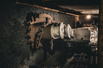 A very old looking machine in a very dark room