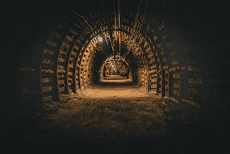 A dark tunnel with a light at the end