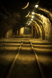 A tunnel with a train track going through it