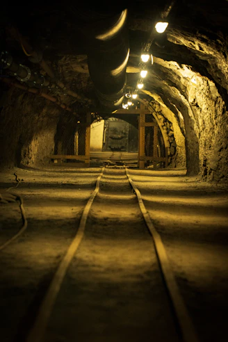 A tunnel with a train track going through it