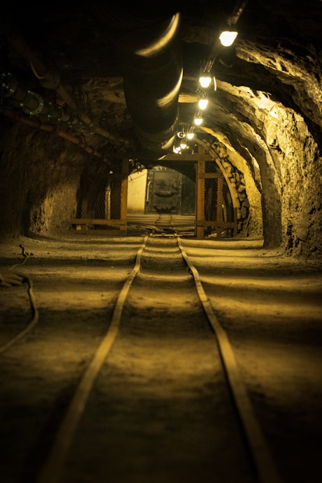 A tunnel with a train track going through it