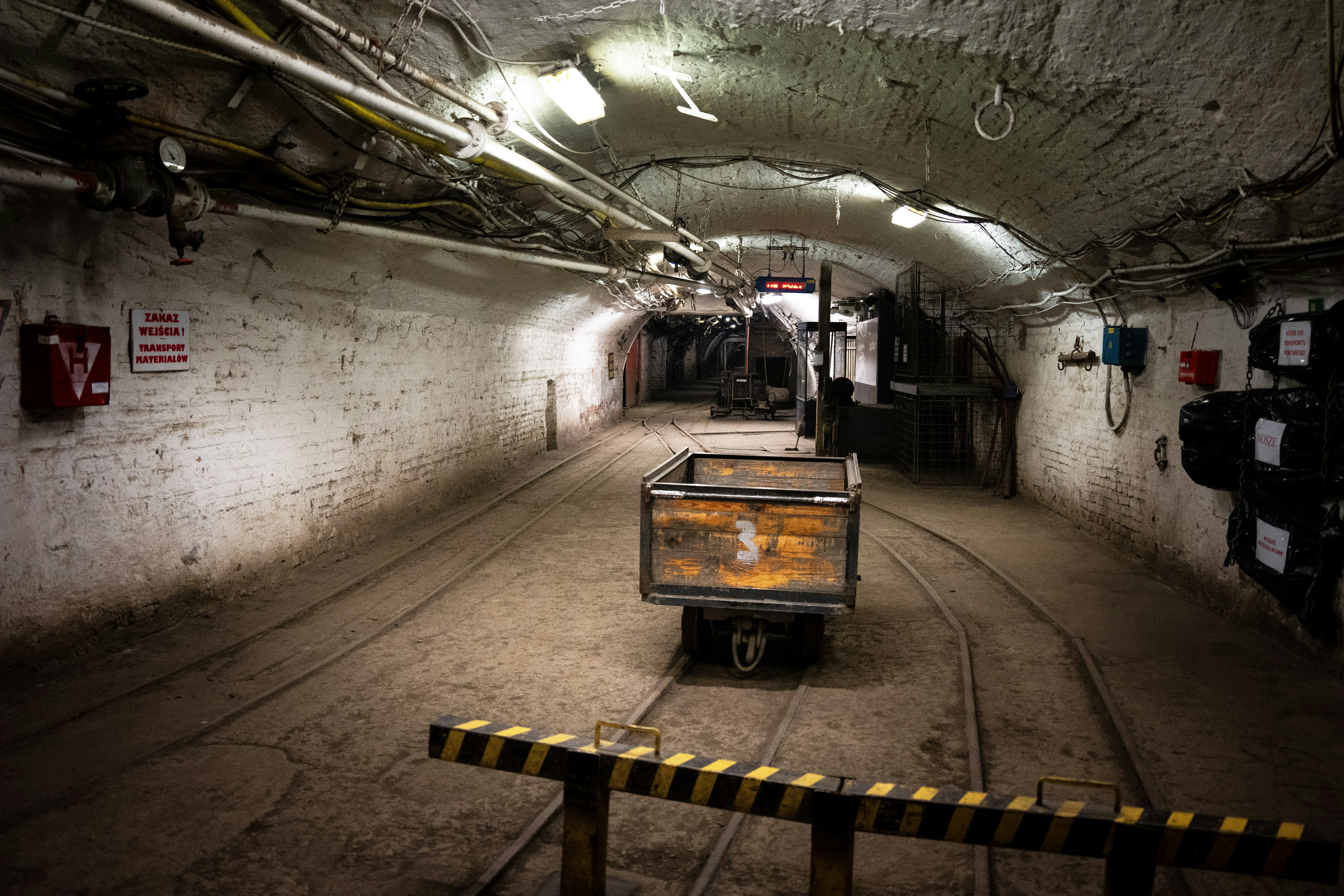 A truck is parked in a dark tunnel