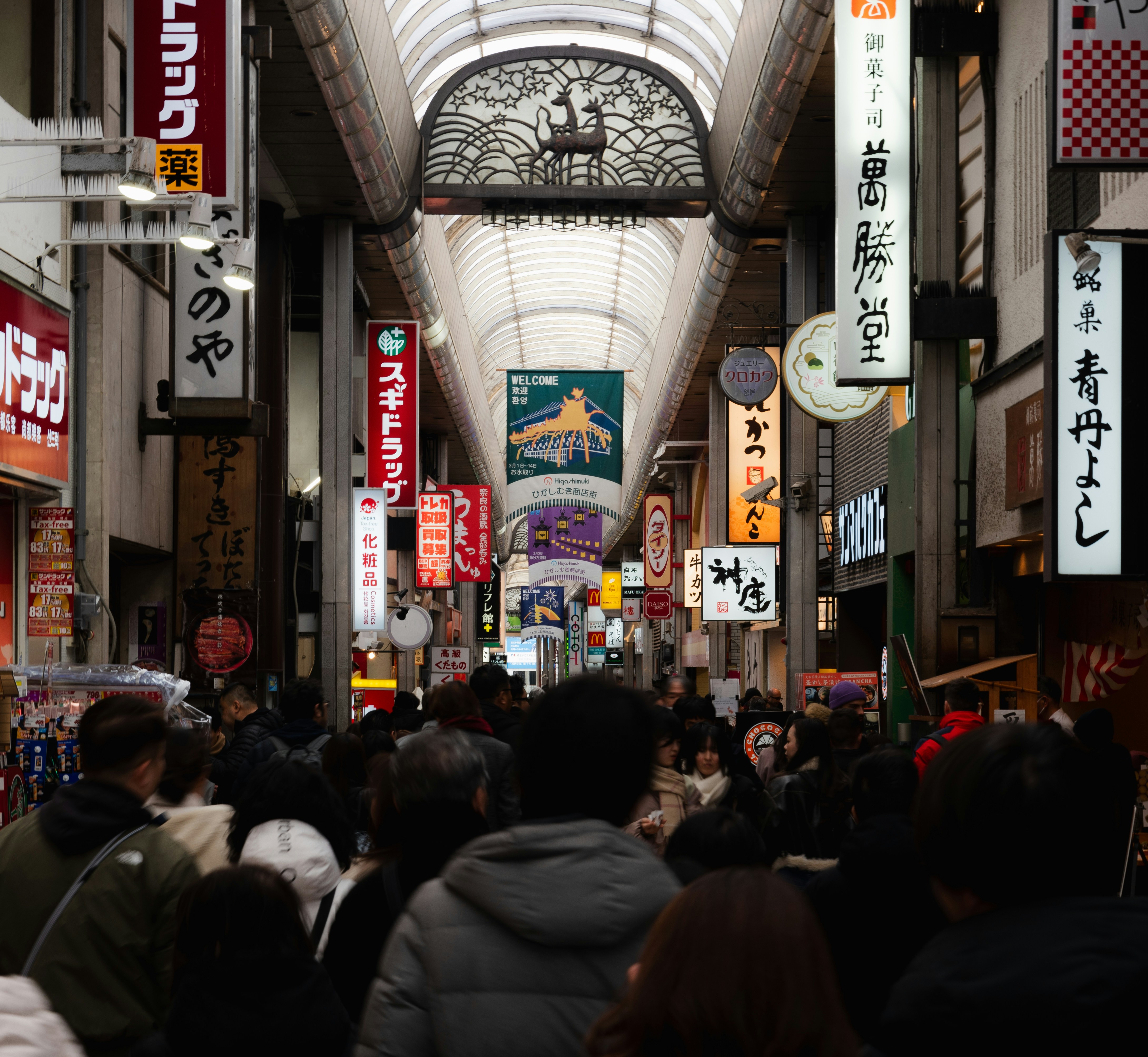 A large group of people walking down a street