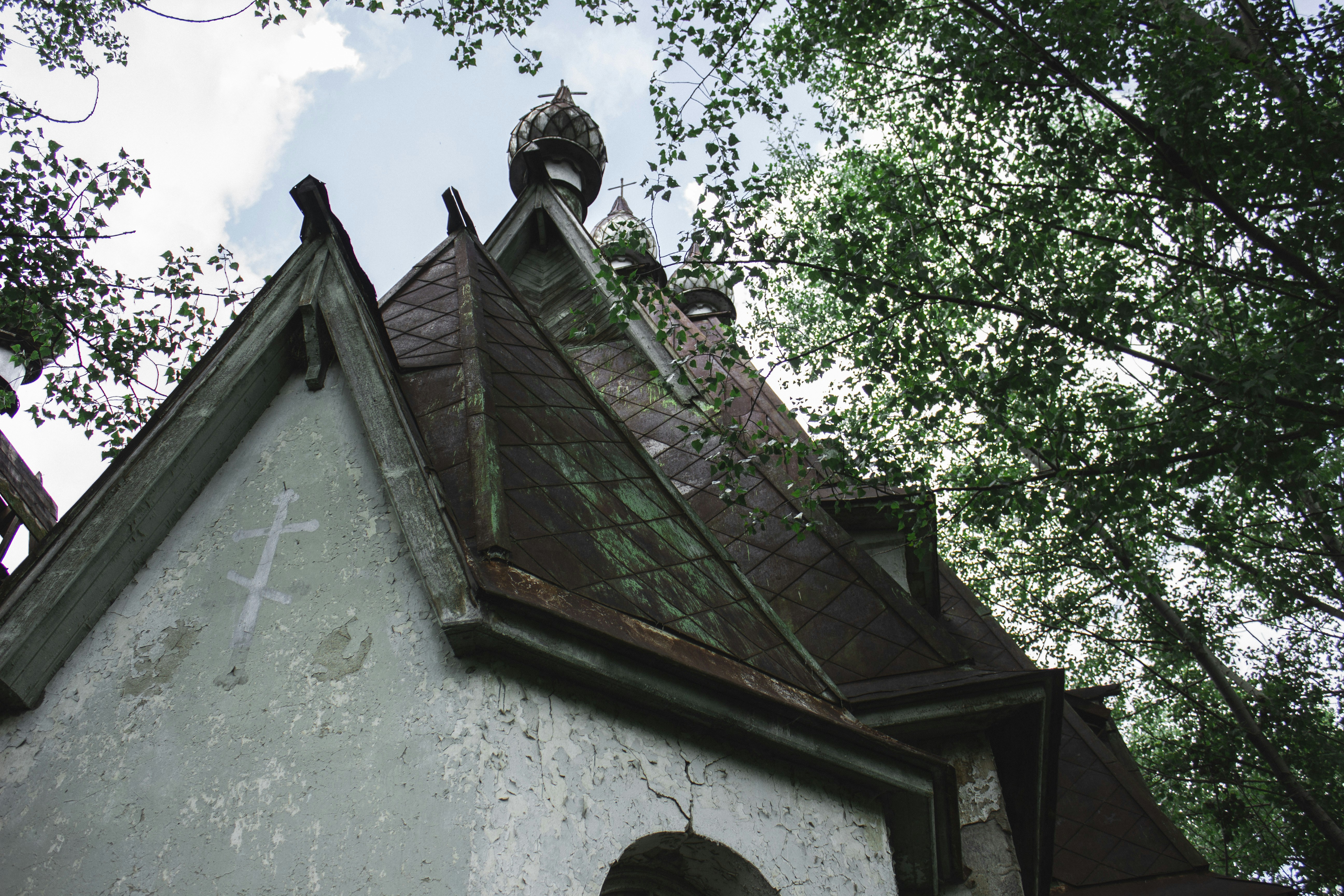 A church steeple with a clock on the top of it