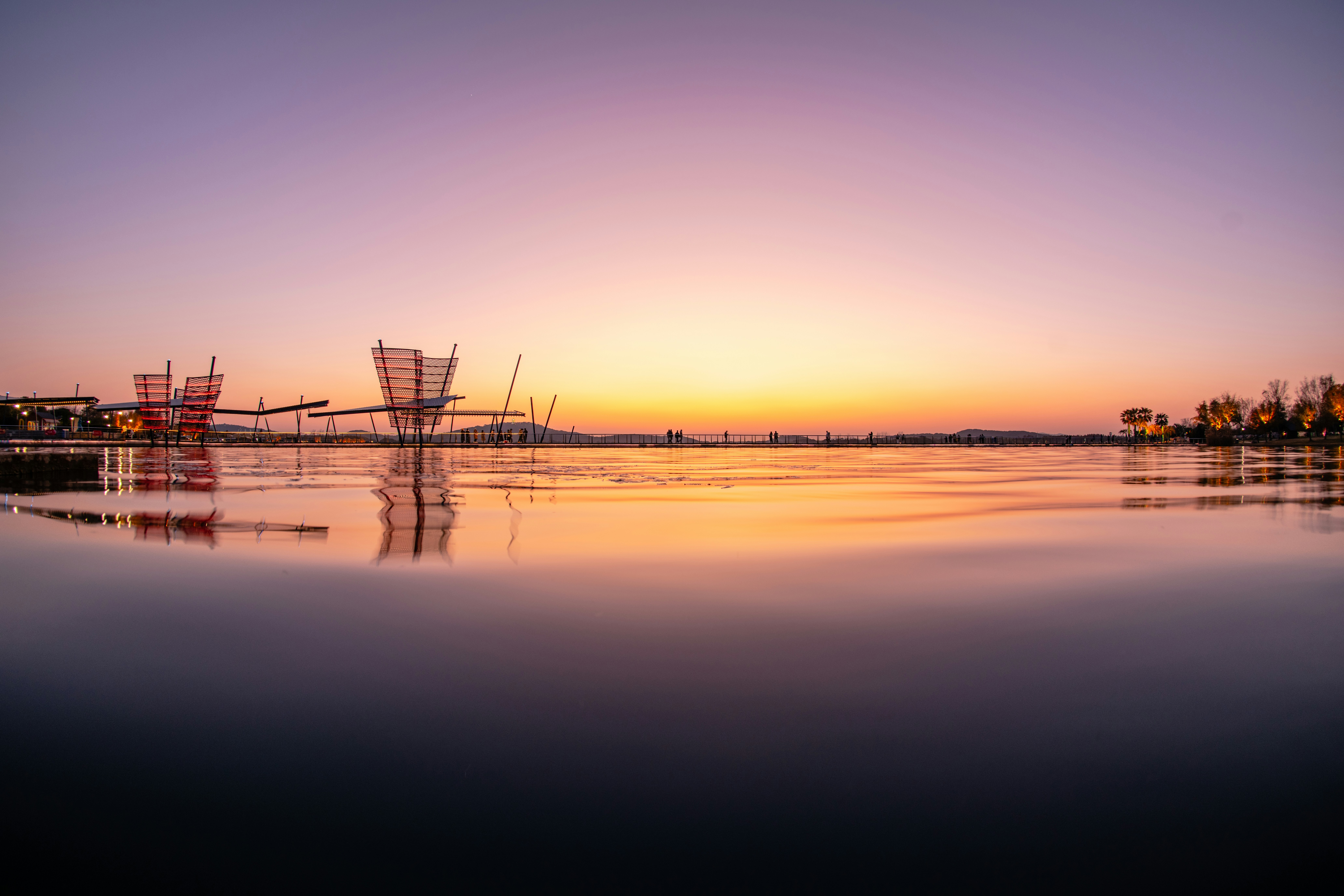 The sun is setting over a body of water