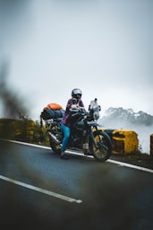 A person riding a motorcycle on a road