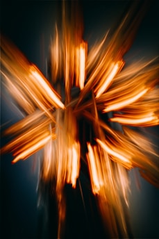 A blurry photo of a cross made of wood