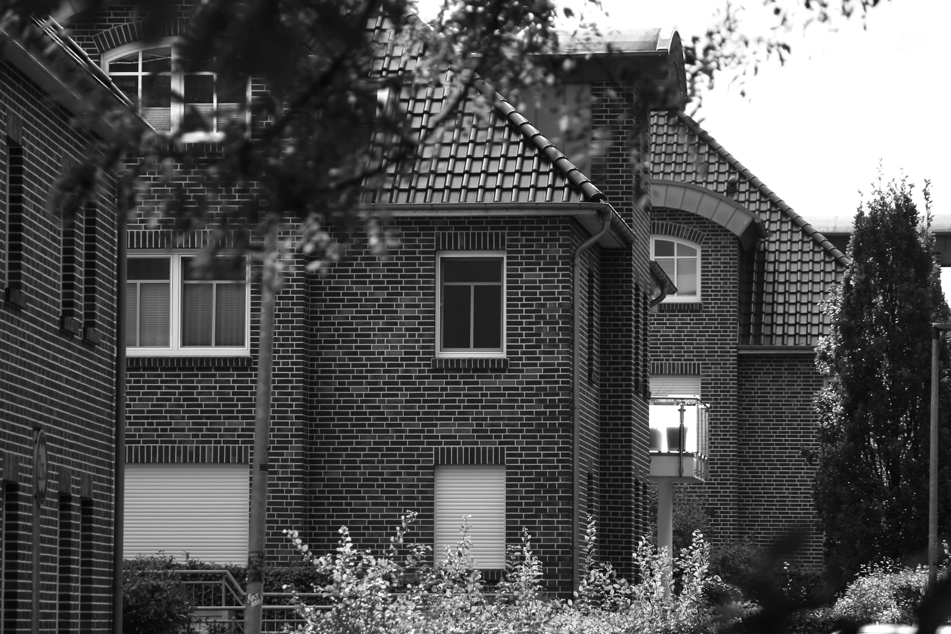 A black and white photo of a row of houses