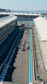 An aerial view of a race track with cars on it