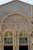 A building with scaffolding on the front of it