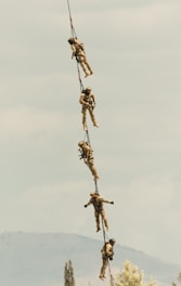 A group of people hanging from a rope