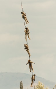 A group of people hanging from a rope