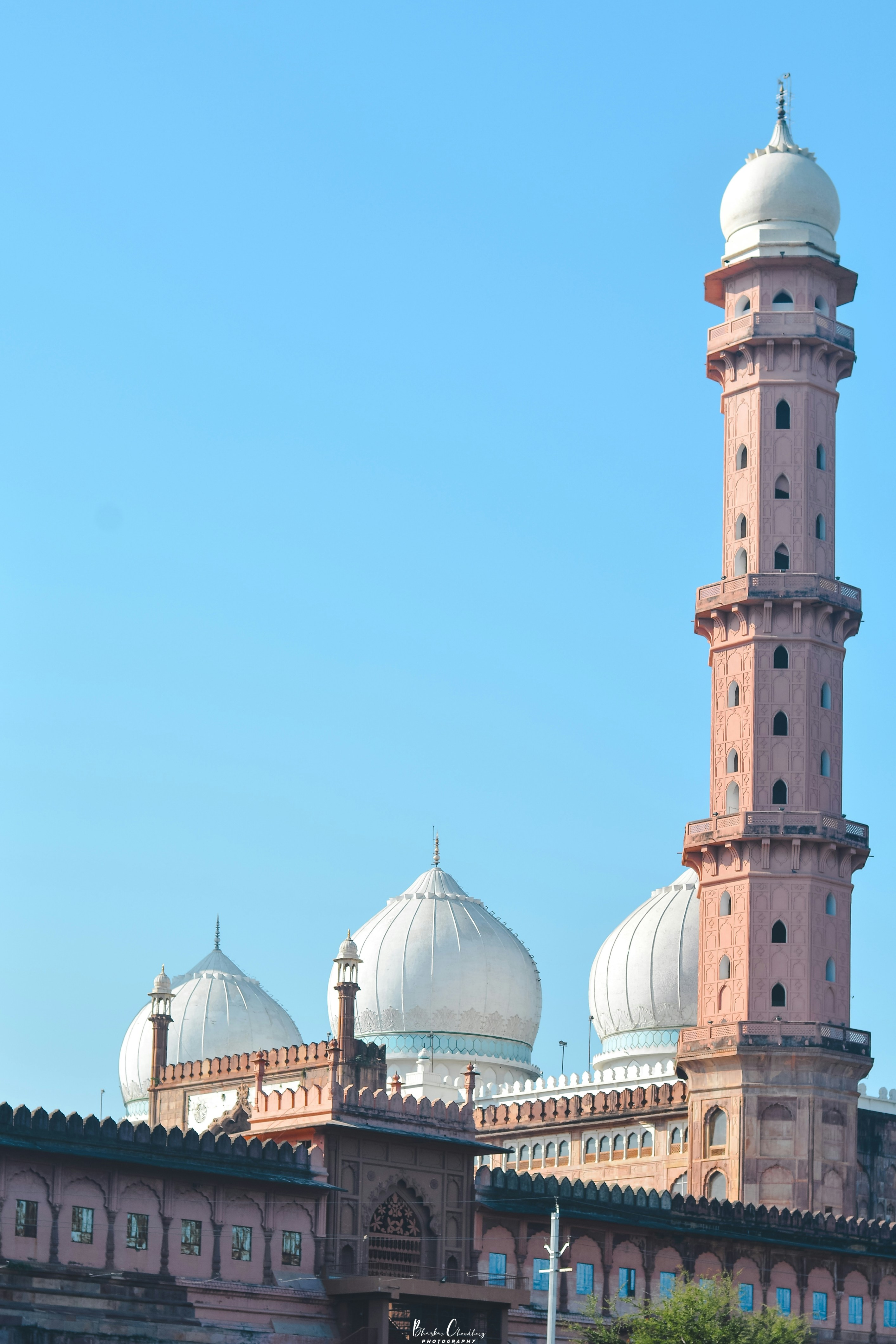 A tall building with a white dome on top of it