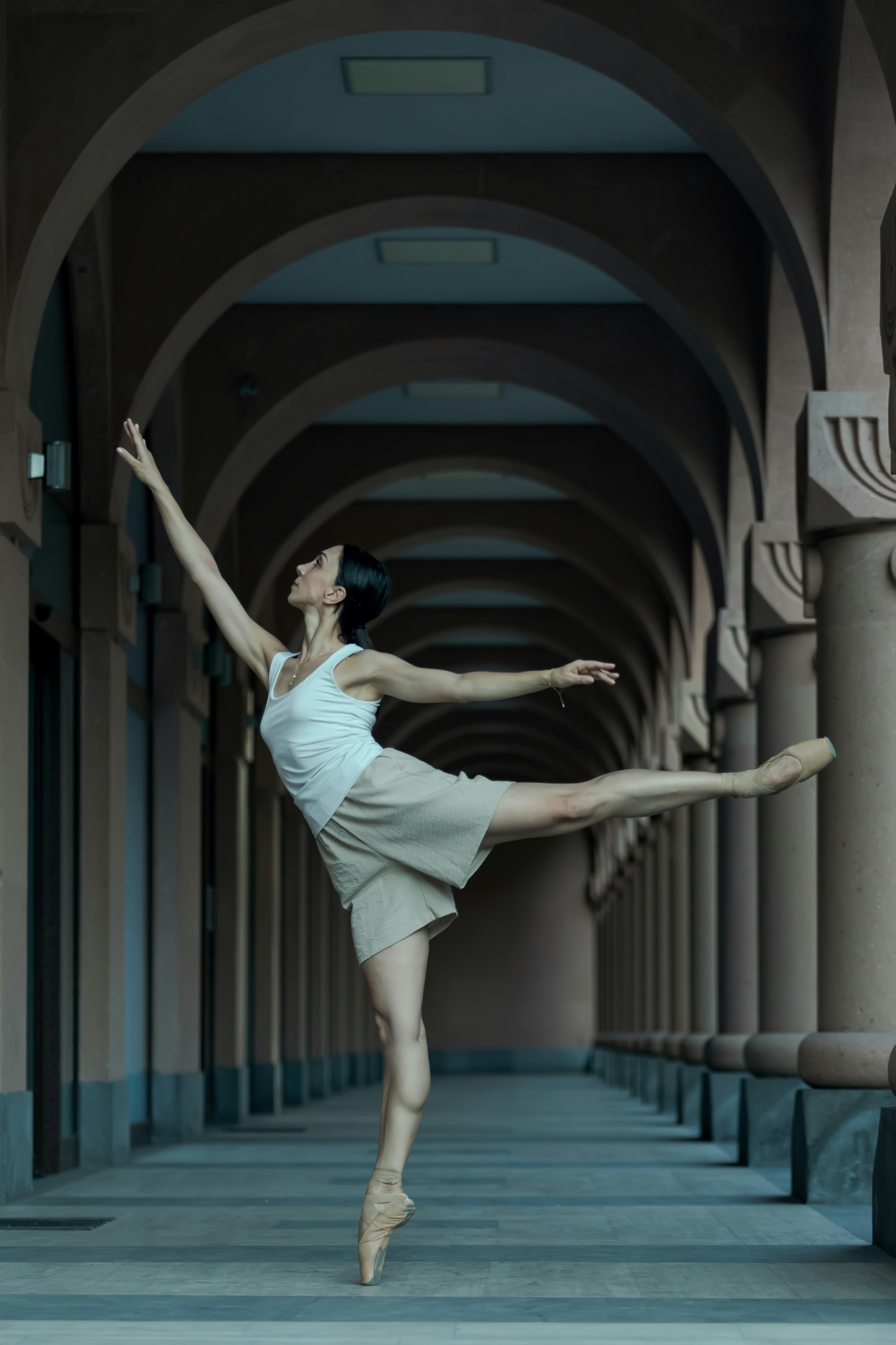 A woman in a white dress is dancing