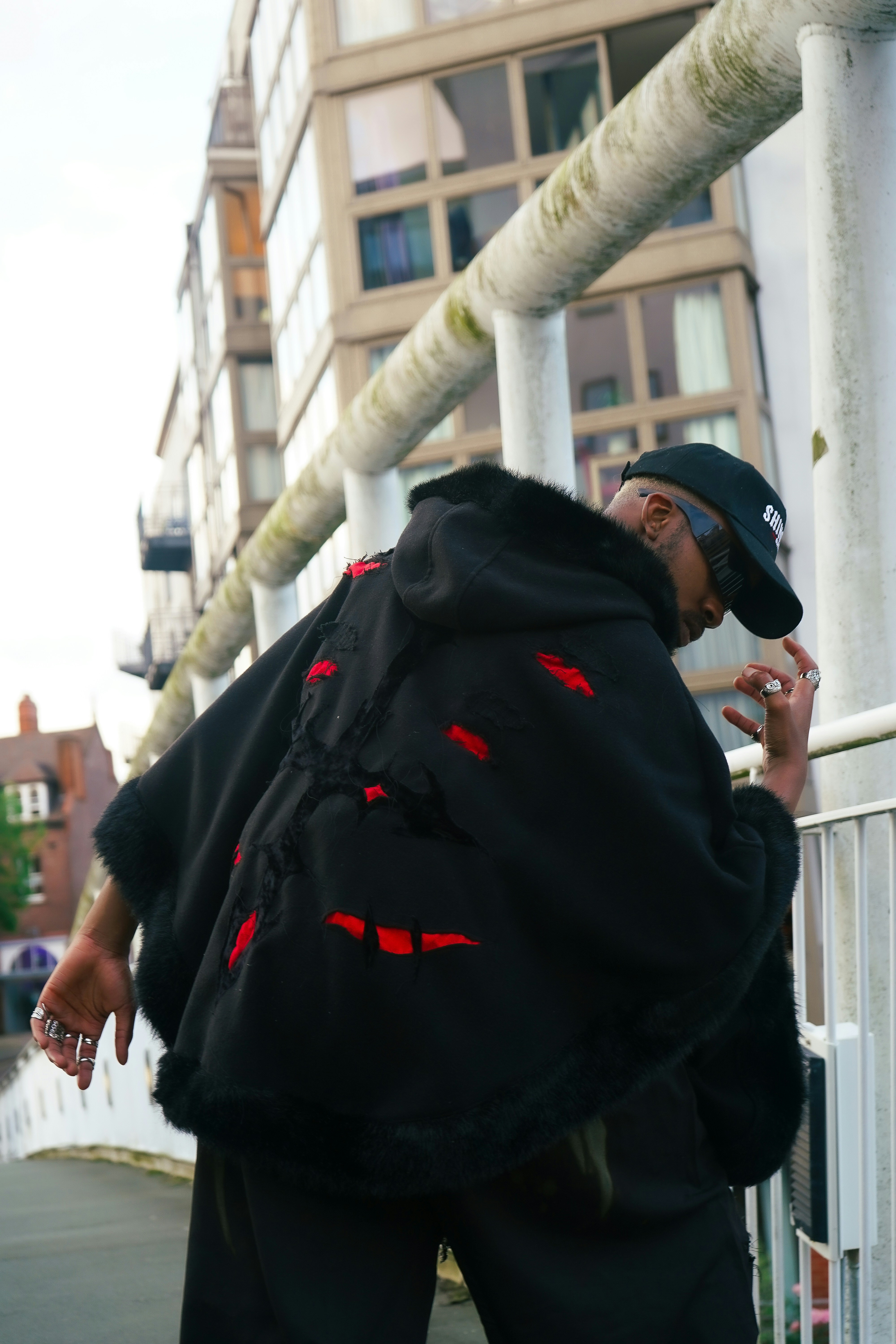 A man smoking a cigarette on the street