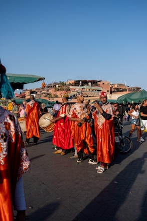 A group of people standing around each other