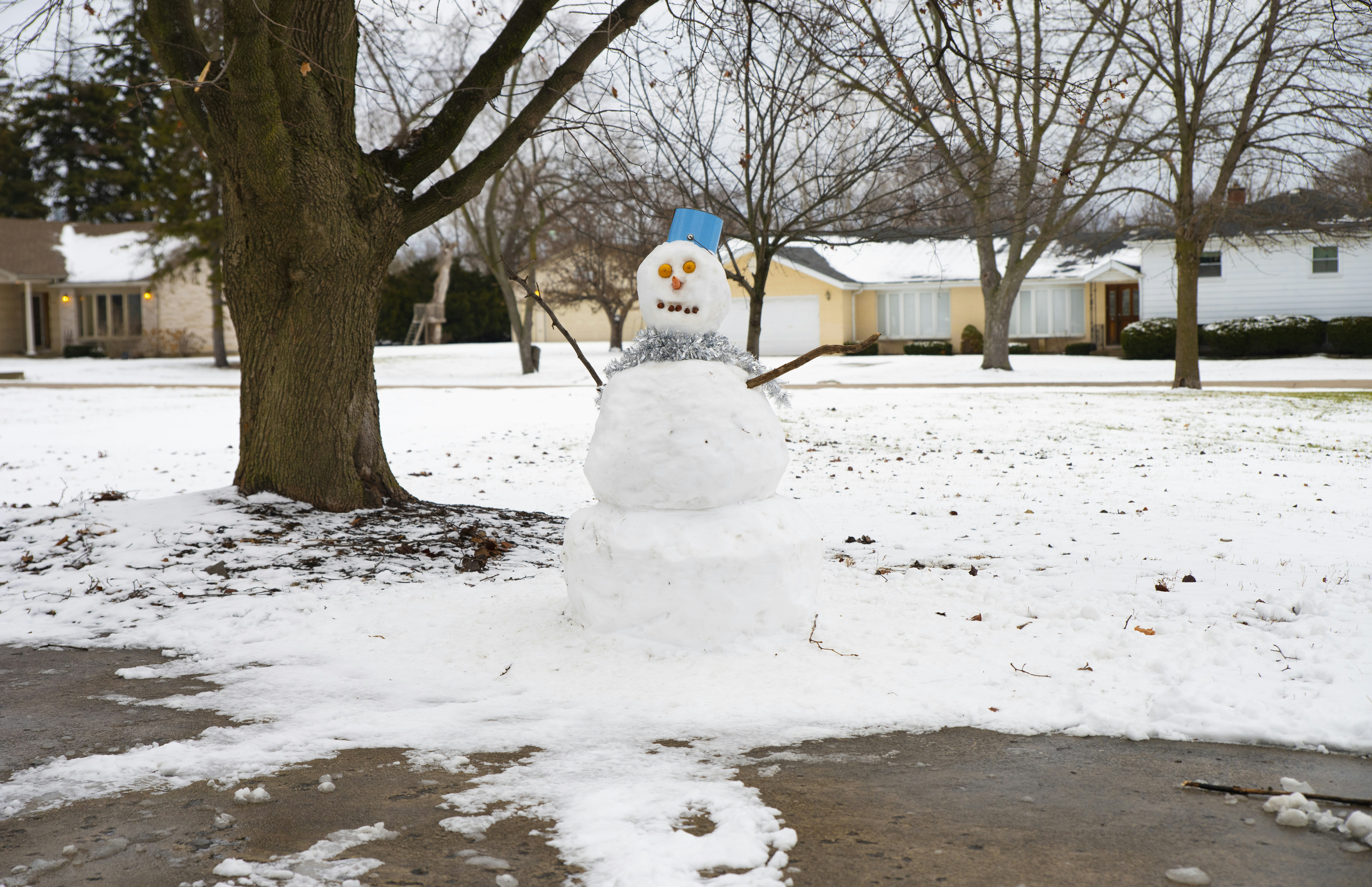 A snowman that is standing in the snow
