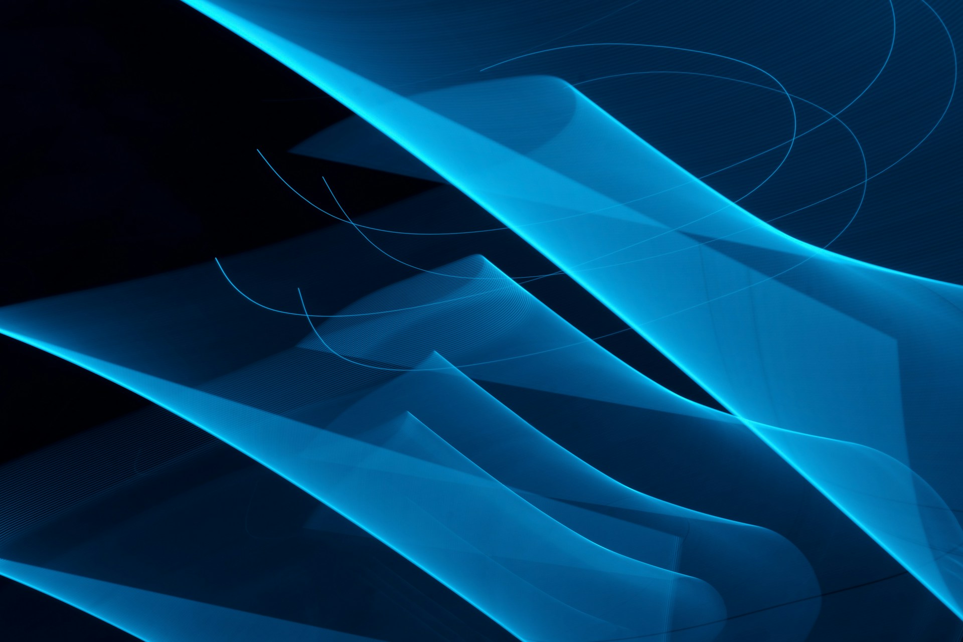 A black and blue background with lines and curves
