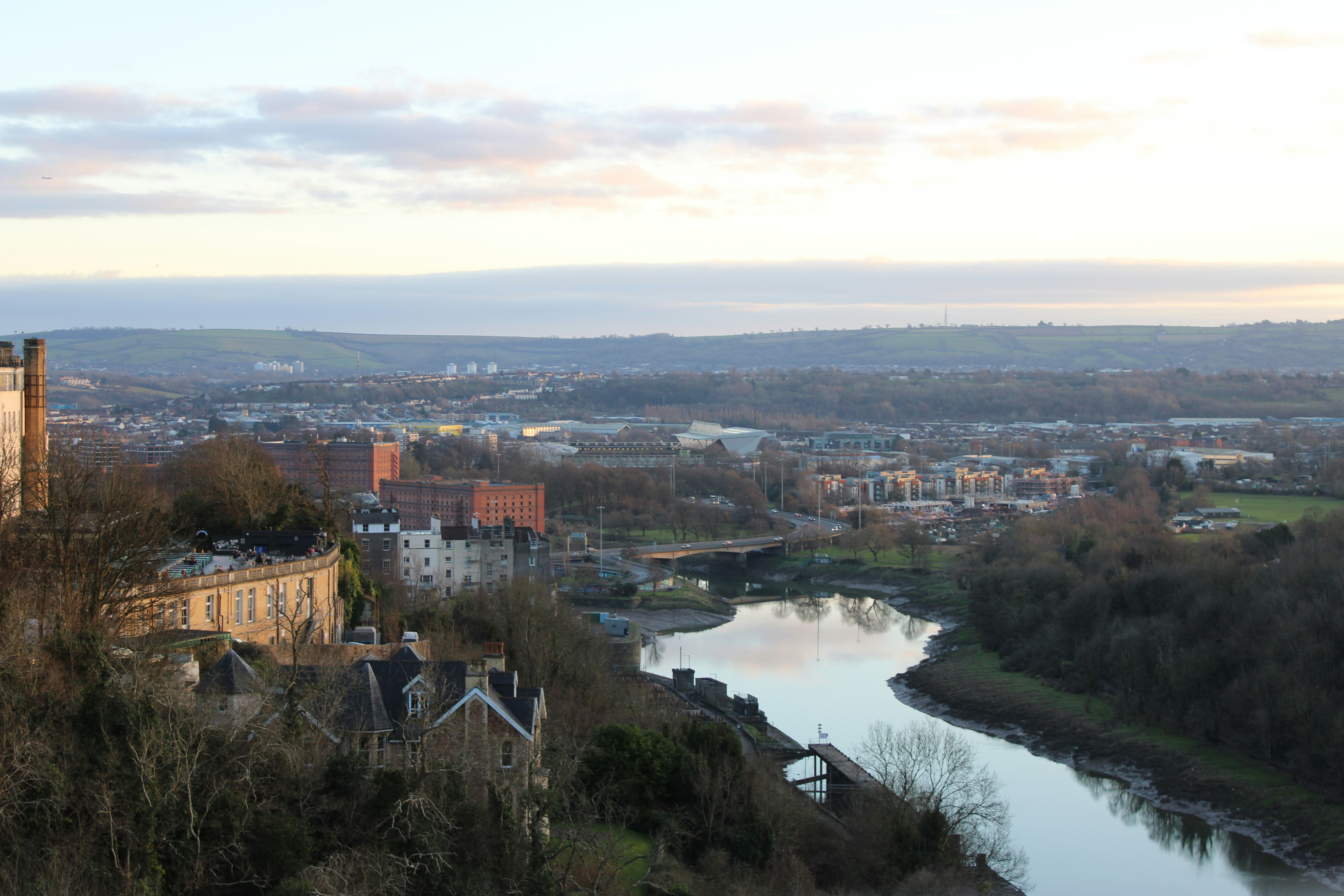 A river running through a lush green countryside