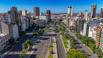 An aerial view of a city with a train on the tracks