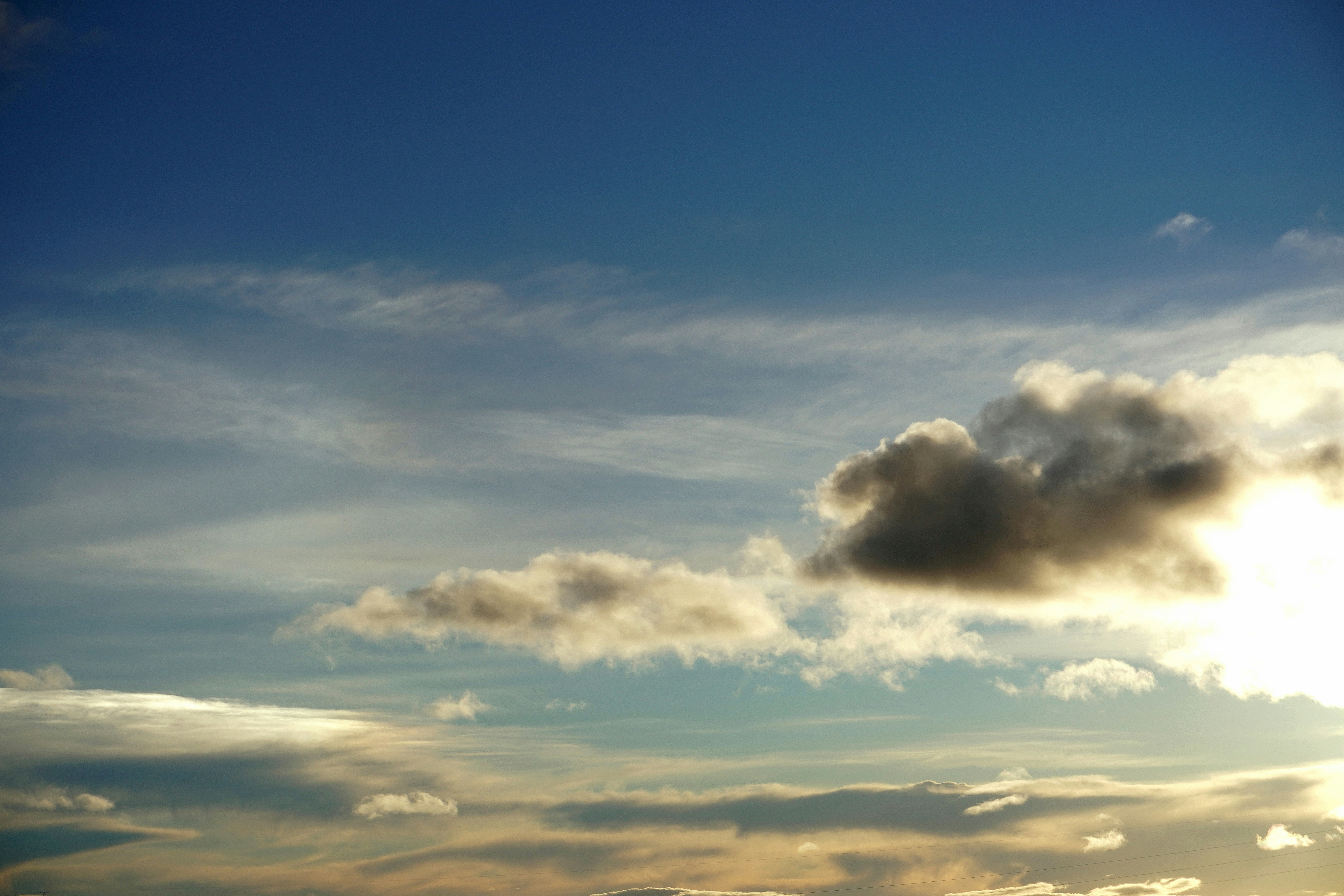 The sun is shining through the clouds over the ocean photo – Free ...