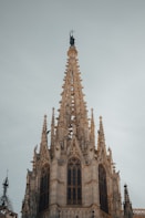 A very tall building with a clock on it's side