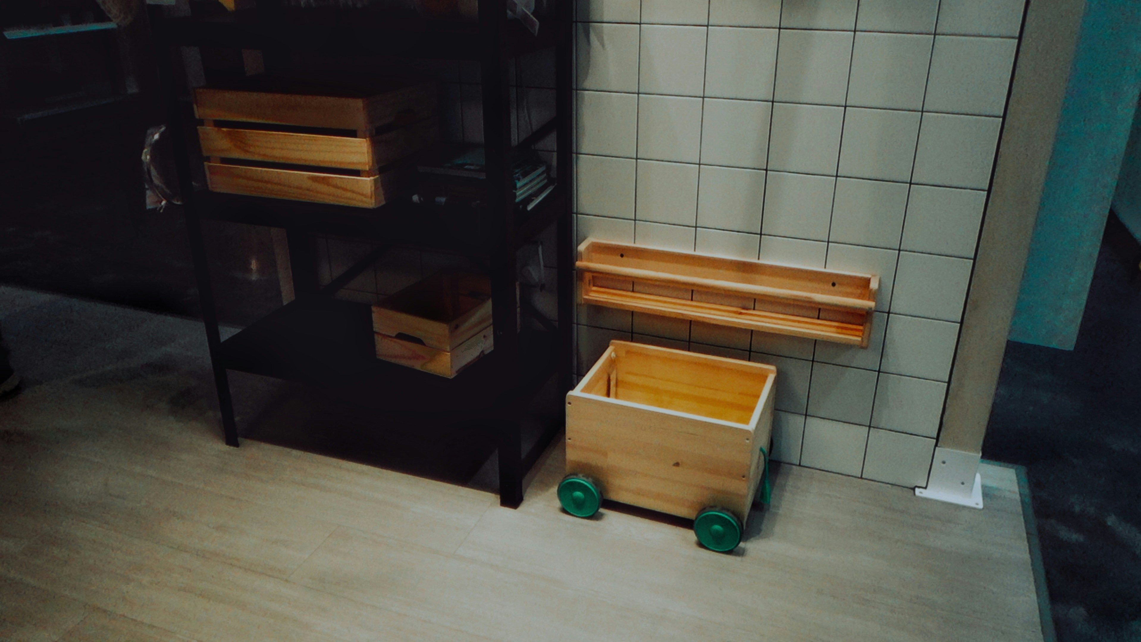 A bathroom with a toilet, sink, and shelves